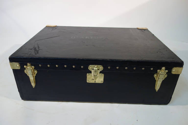 Louis Vuitton  Car trunk  
Black  canvas  with  brass Lock
The 2  little  Brass  Handel  are  use  for fixed   the trunk  on the trunk . 
Inside   you can find  the original tray  . 

Dimensions 83 cm wide x 27 cm high x 61 cm deep

All the
