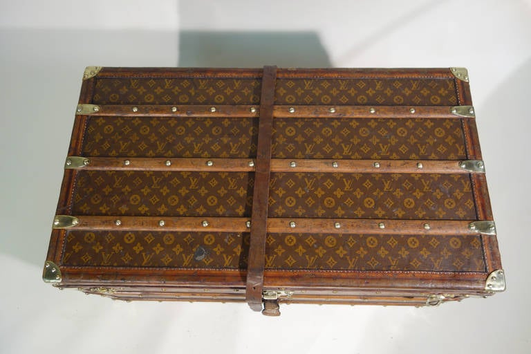 This authentic Louis Vuitton Steamer Trunk, circa 1910, 
Stencil monogram canvas, 
All brass hardware, and leather trim. 
Top of the line model. 
Original owner initials on sides: 