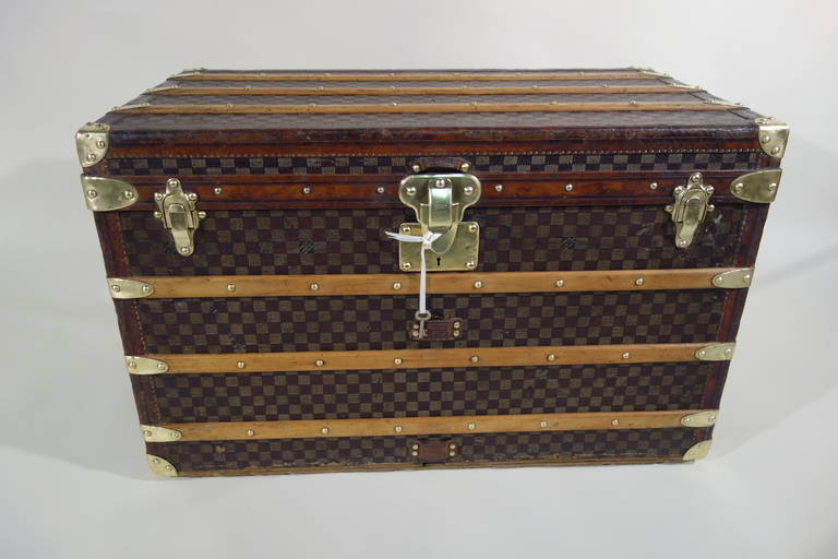 Authentic Louis Vuitton steamer trunk, circa 1900s, with key,
Features Damier canvas, all brass hardware, and real leather trim (not iozine). Top of the line model. Original exterior and interior conditions.!
Damier pieces in excellent