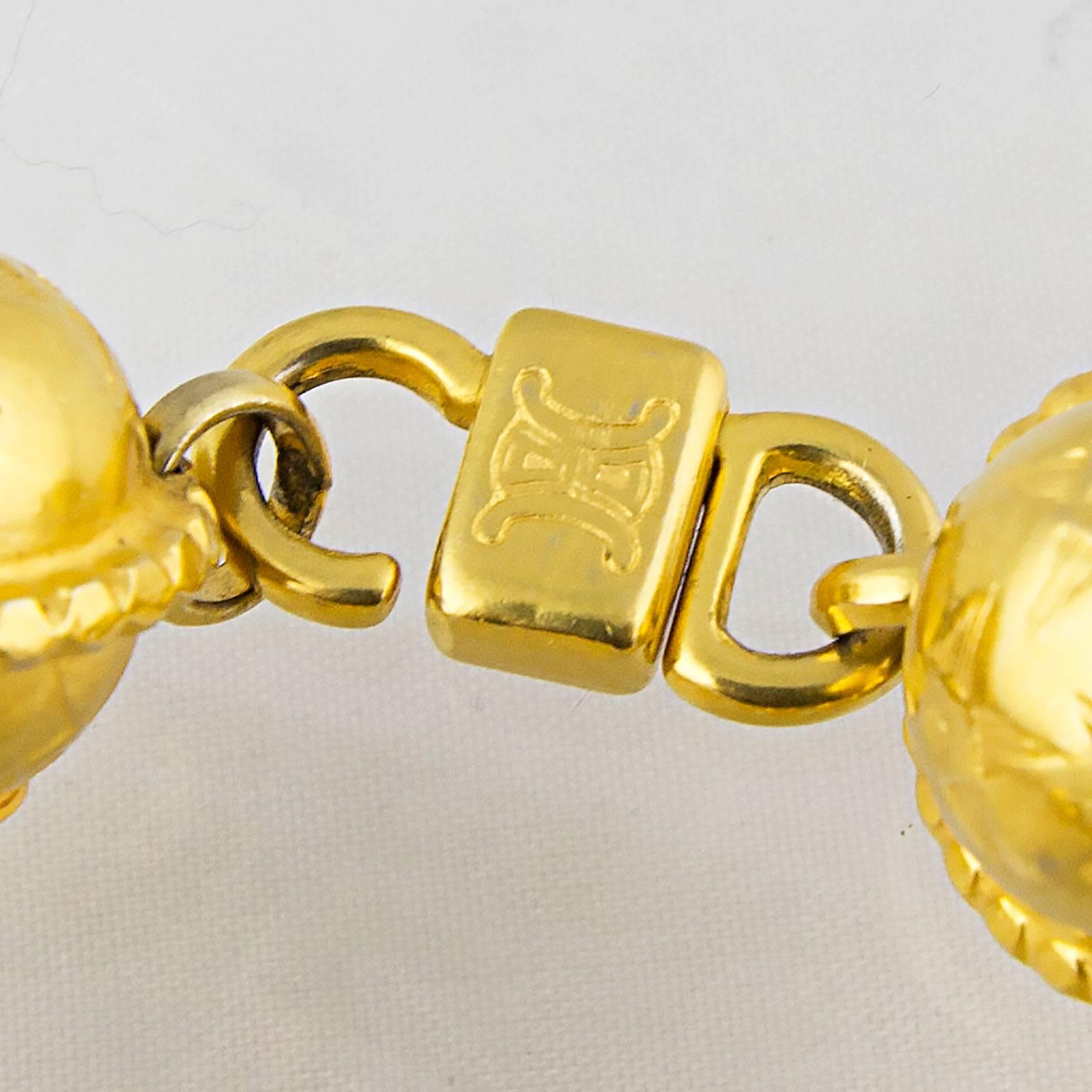 High carat gold plated metal.
Celine twist logo clasp.
A great fashion piece!