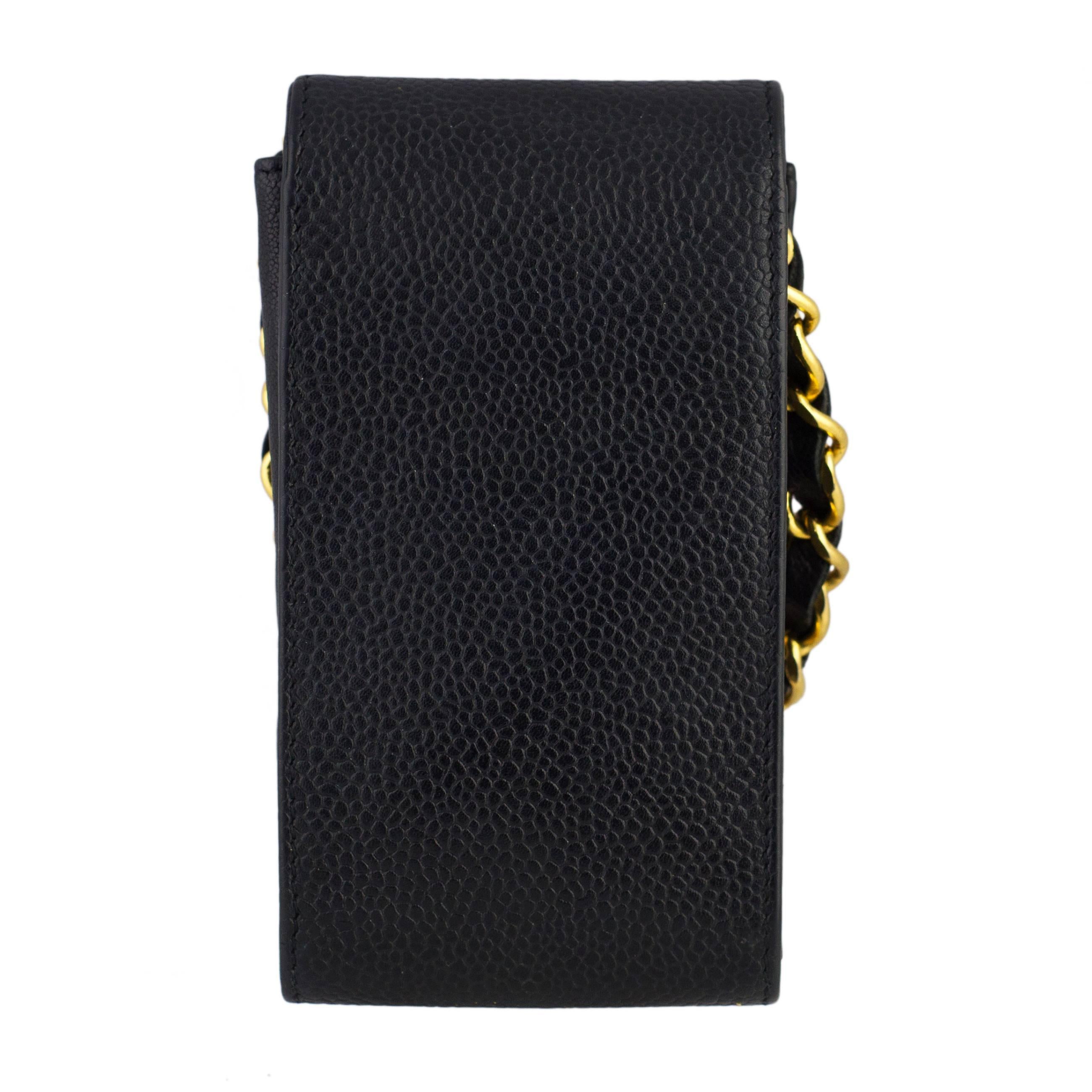 Chanel Black Caviar Phone / Lipstick Case
High carat gold plated hardware. 
With serial number in tact.
Made in France in the 1990's
Please note : This does NOT fit the iphone as it made before the launch of the iphone. It is ideal for small phones,
