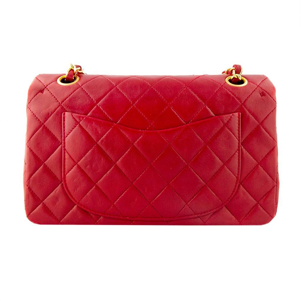 Chanel red lambskin quilted leather medium classic flap bag.
The original Chanel red is a rich and enticing colour adding a pop of French Coco Chanel chic to any enviable handbag collection.
With high carat gold plated hardware. 
With serial number