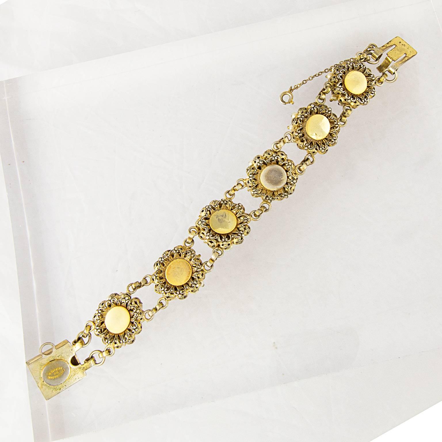 A couture vintage bracelet by Christian Dior manufactured by Kramer.
In the 1950s and 60s, Kramer produced fantastic and now very collectable costume jewellery for Christian Dior.
Fully signed. 
In a great pre-loved condition. 
Don't hesitate to