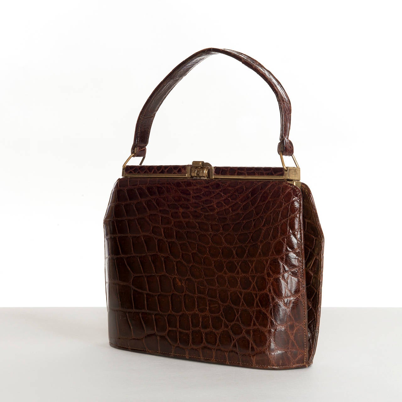 A superb, high quality, Vintage Crocodile handbag, made in circa 1960, probably for Aspreys of London. English made, to the highest standards, the bag is fitted with gold tone hardware. The suede lined interior has two leather trimmed pockets and a
