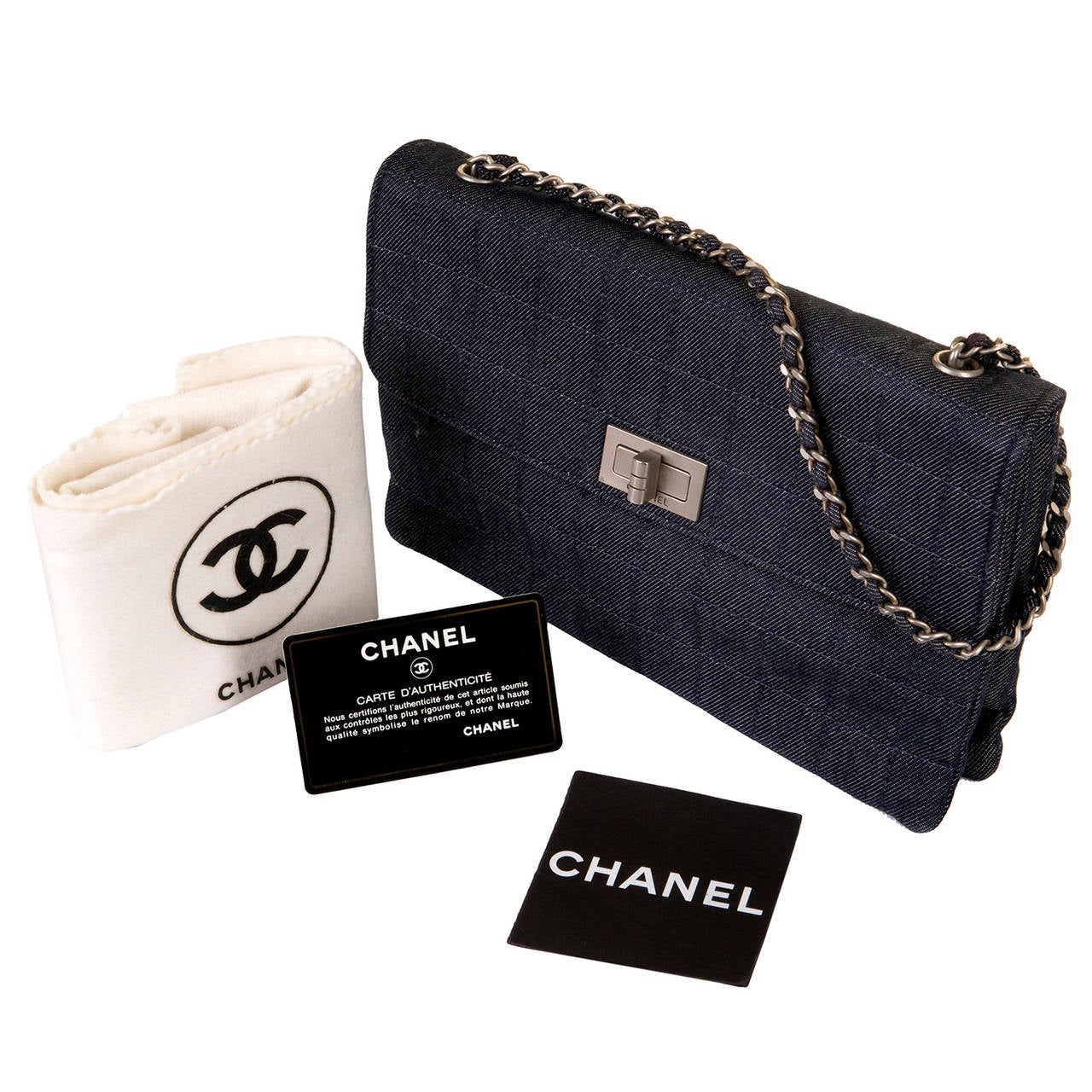 A Rare Très Chic Chanel 25cm Bag in Blue 'Window Pane' check Denim, complemented with silver palladium hardware. In 'Store-fresh'condition, this special-order bag is fitted with a 'Mademoiselle' clasp, with a chain strap interlinked with denim. This