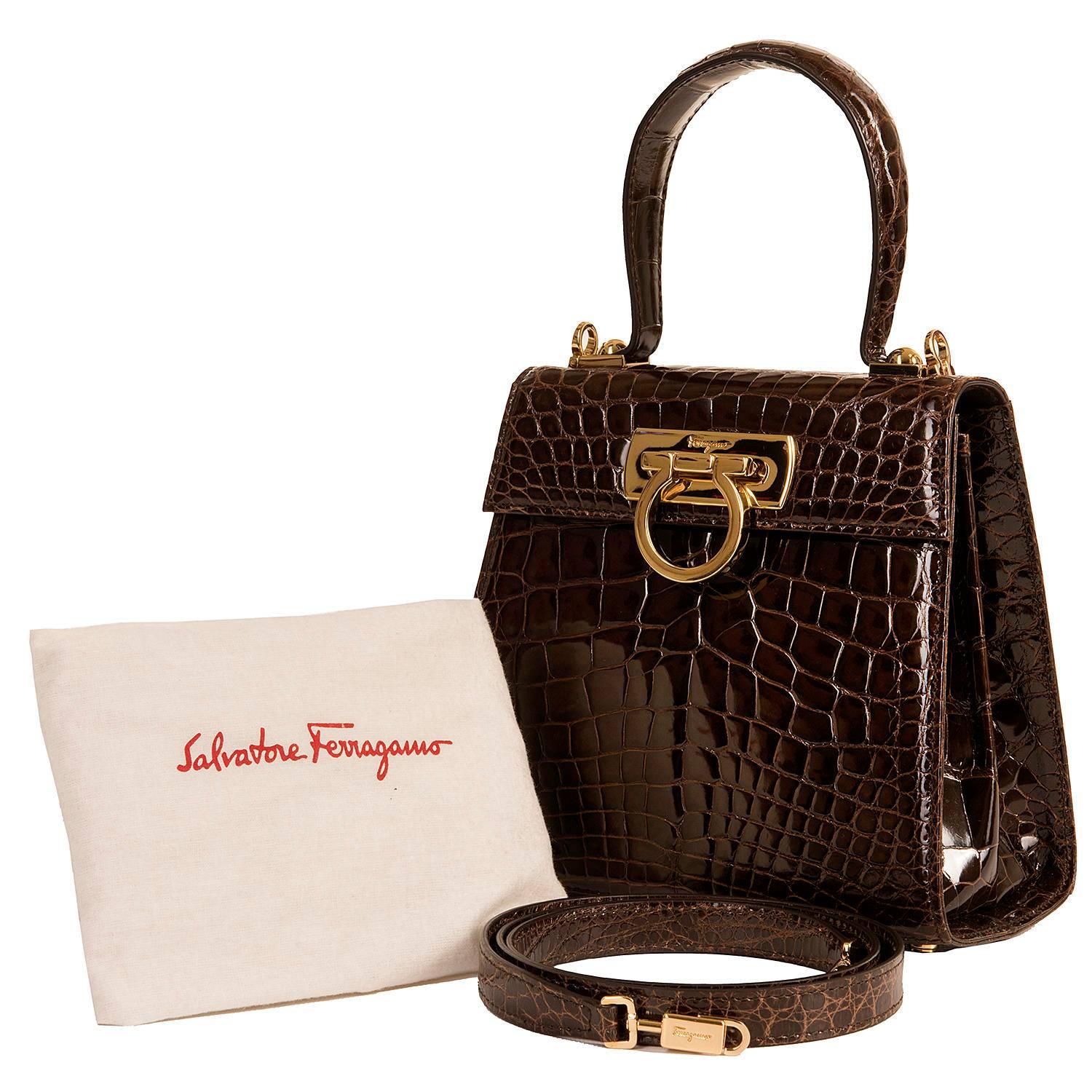 Never worn, this absolutely fabulous 'Shiny Porosus Crocodile' Bag by Salvatore Ferragamo, is a 'Limited Edition' - number 30 of only 100 made worldwide. Finished in Chocolate Brown with Gold hardware, with a beige suede interior, the bag is
