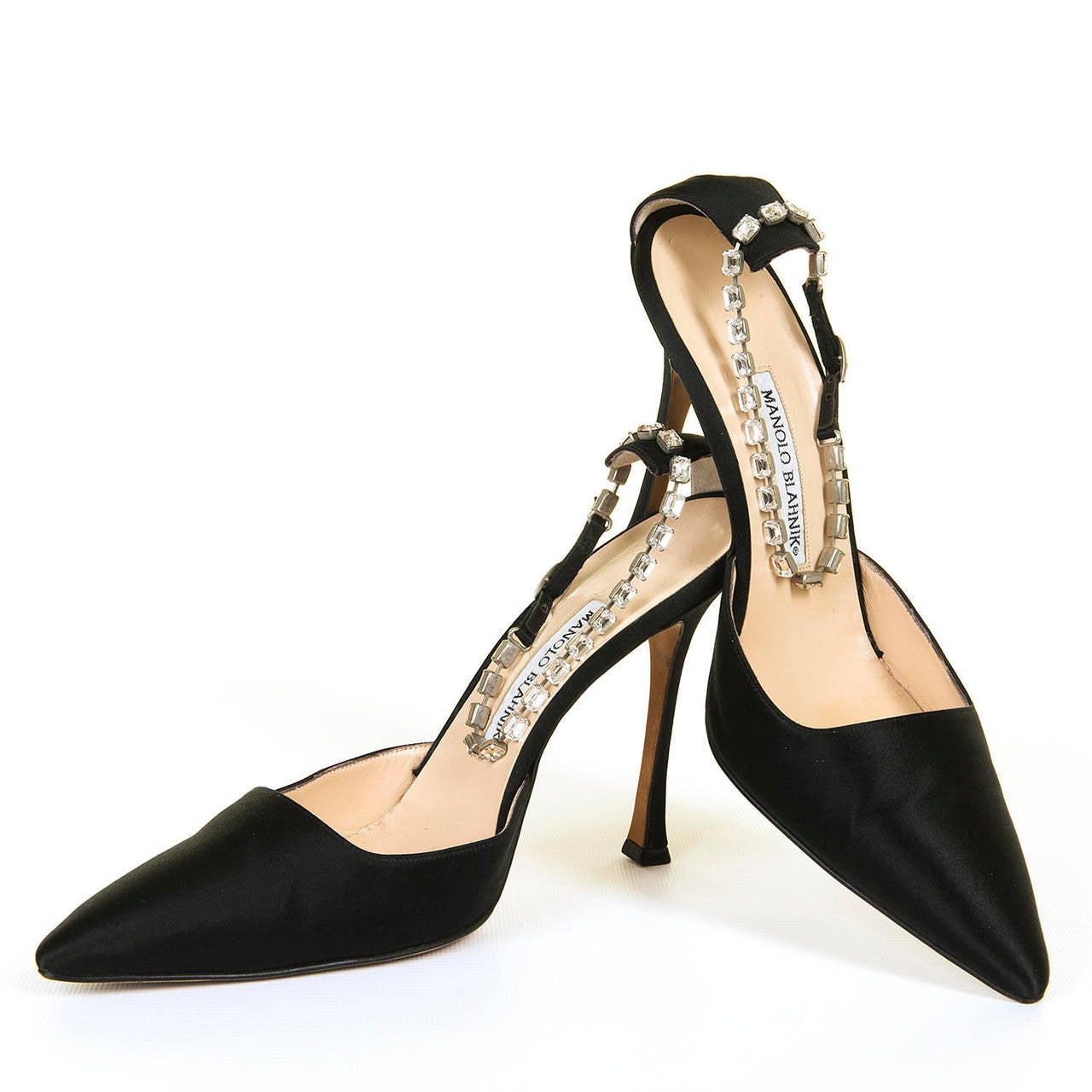 RARE COLLECTORS ITEM. A pair of Black Silk Shoes (9.5/10 USA - 40.5 EU) with a matching Handbag all decorated with clear cut-glass stones by the legendary designer Manolo Blahnik. Made in circa 1991, the shoes & bag were formerly part of the