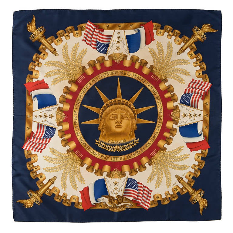 This rare and important silk scarf was made as a limited edition by Hermes, commemorating the 4th July Independence Day and the Statue of Liberty Centennial in 1986, and it comes complete with it's original box. The design was created by Joachim