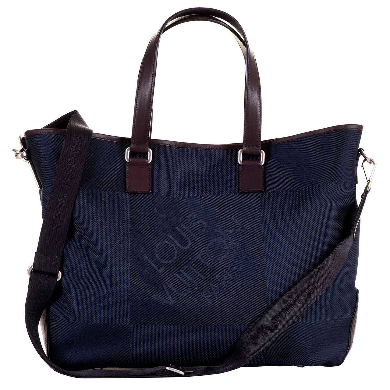 This fabulous 'Sac cabas' - shopping Bag, by Louis Vuitton, can be worn as a tote, or with it's adjustable strap can be used as a shoulder or cross-body bag. Finished in Navy Blue with choc. brown trim, and silver palladium hardware, the bag is in