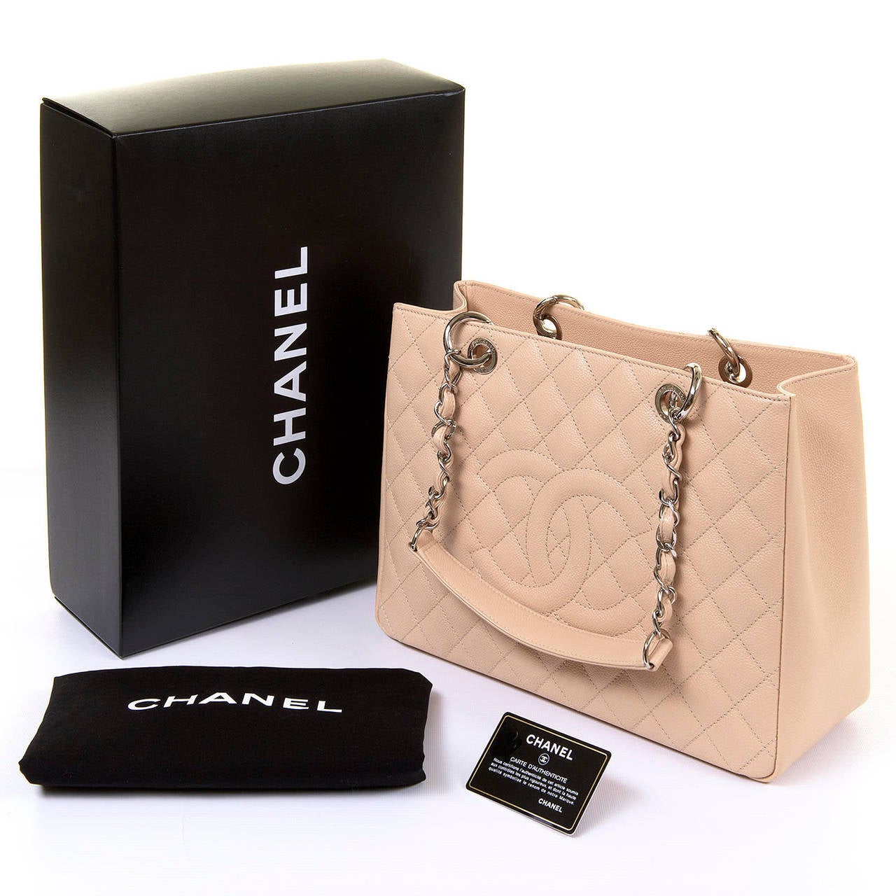 This gorgeous Chanel Shoulder bag is in pristine 'Store-fresh' condition, and comes complete with it's original Box, Dust Sack and Authenticity Card. The bag is finished in quilted Vanilla Caviar Leather with the iconic double 'C' logo embossed to