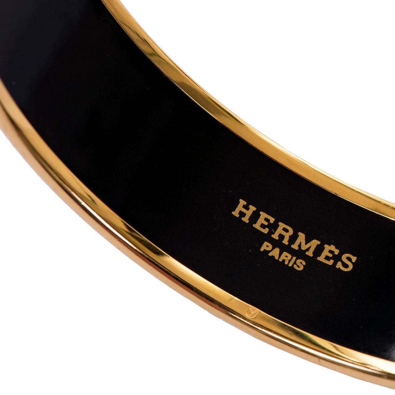 Absolutely exquisite Hermes Gilt & Enamel Bangle, signed and still with it's original box. The bangle depicts Race horses in their different coloured, racing livery, together with the individual saddle & buckle detail for each horse. This superb