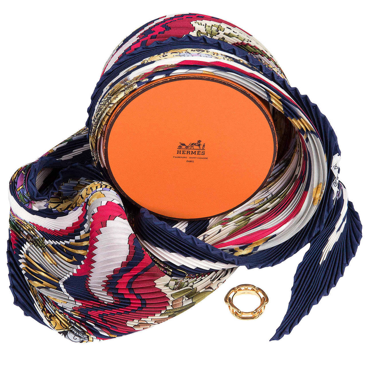 A Rare Hermes Pleated or 'Plisse' Silk Scarf, 'La Ronde des Heures', designed by Loic Dubigeon in 2000 to celebrate the Millennium. In pristine 'store-Fresh' condition, the scarf comes with an Hermes Gold Scarf ring, it's original Hermes circular