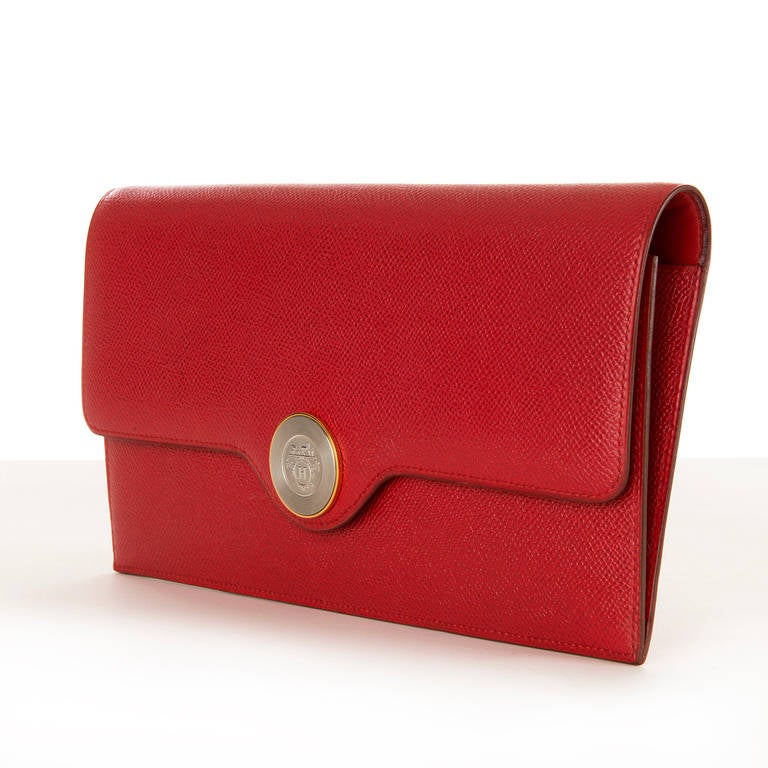 A simply stunning Red Hermes Clutch Bag in gorgeous Epsom leather. Fitted with the iconic Hermes gold & silvered medallion clasp, the clasp centred with the famous Hermes 'Horse & Carriage' logo. The bag is in pristine 'Store-Fresh' condition inside