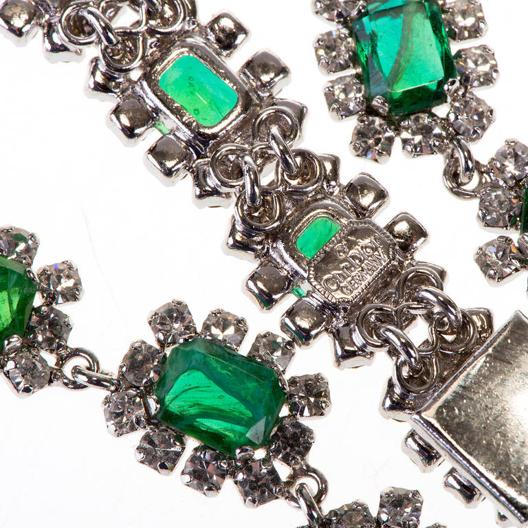 Just the most stunning matching Necklace & Bracelet by Christian Dior. Exquisite quality with superb design are the hallmarks of this Dior set. Made in Germany, for Dior the  silver metal chain is inlaid with emerald green oblong cut glass stones, 