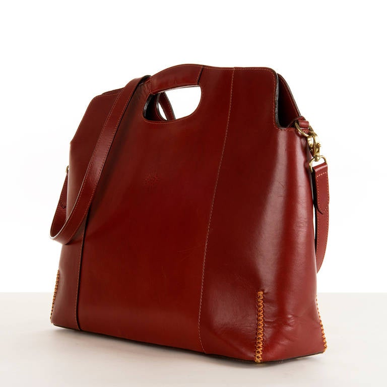 This gorgeous, classic English Mulbery, Burgundy, Large Shopping Bag is made from the finest 'Box' leather, hand-made by highly skilled English Craftsman. Made with the professional women in mind, this sculptured bag can be worn as a cross-body or