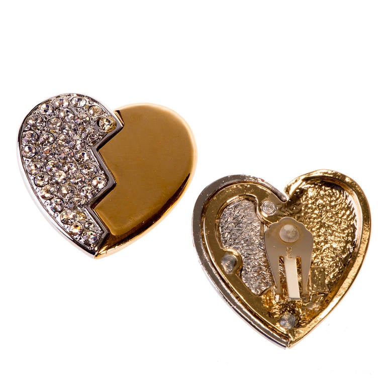 A delightful pair of large, 'Heart'  shaped, gilt-metal and cut glass, clip-on earrings, by Yves Saint Laurent. Sparkle & fun for that party occasion. Signed, YSL.
FREE WORLDWIDE SHIPPING IS INCLUDED IN THE PRICE !