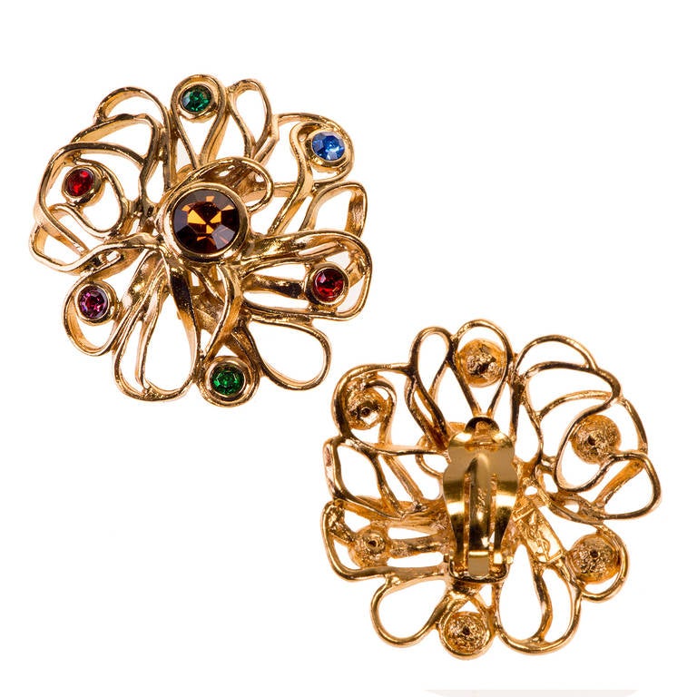 In mint condition, 'Tres-joli' is how the French would describe these beautiful pair of gilt-metal and coloured cut-glass stone, clip-on earrings, by Yves Saint Laurent. Signed 'YSL'.