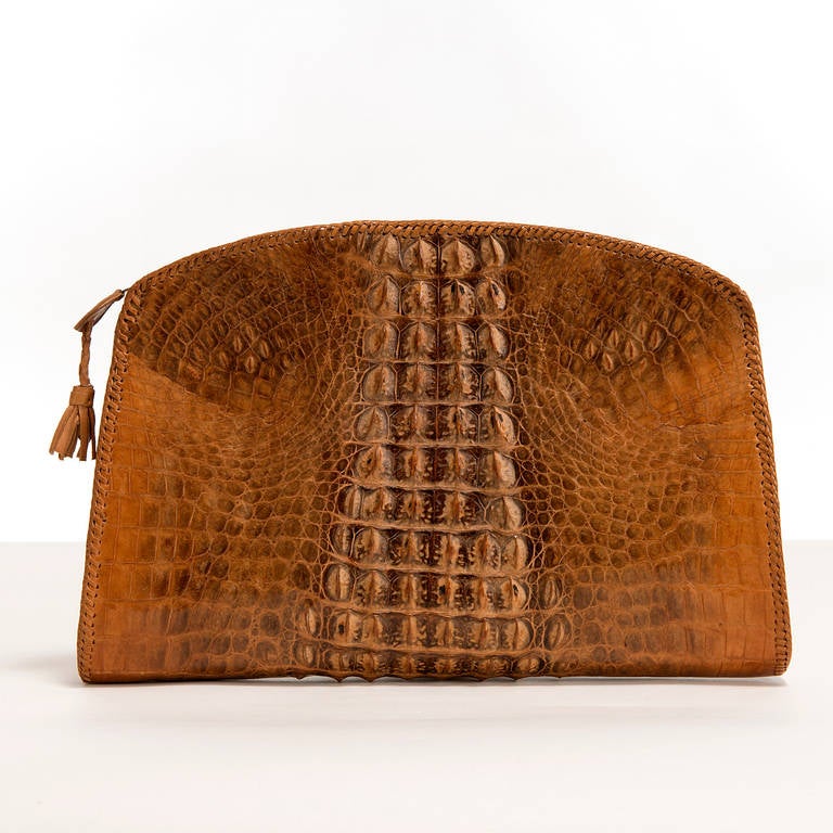 A Great Vintage, Art Deco Clutch Bag. The colour and texture of this Clutch bag has just got better and better over the years. Produced in the 1930's, this entirely handmade crocodile skin bag, is quite unique.  Made from crocodile from the African