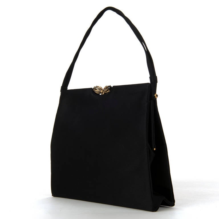 A superb, Vintage Black Satin, Evening Bag by Rayne of London. Rayne were appointed shoe & handbag makers to 'Her Majesty The Queen' and this exquisite bag is a classic example of their work. Known for their attention to detail this bag is fitted