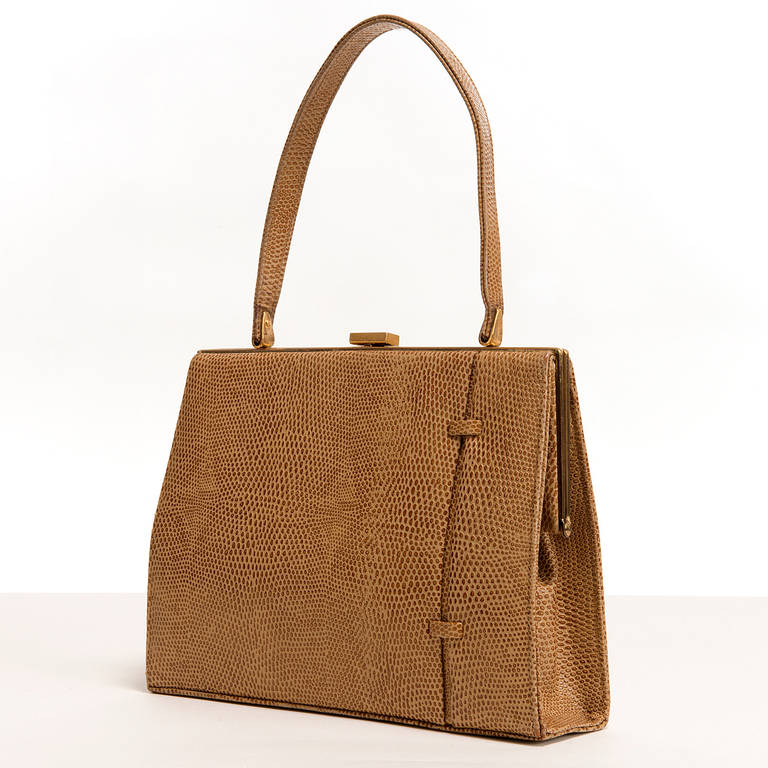 The finest materials have been used to produce this classic 70's Vintage Handbag, by Asprey. Carefully matched skins have been selected together with top quality goldtone fittings, with the pockets, to the light Brown suede interior, also trimmed