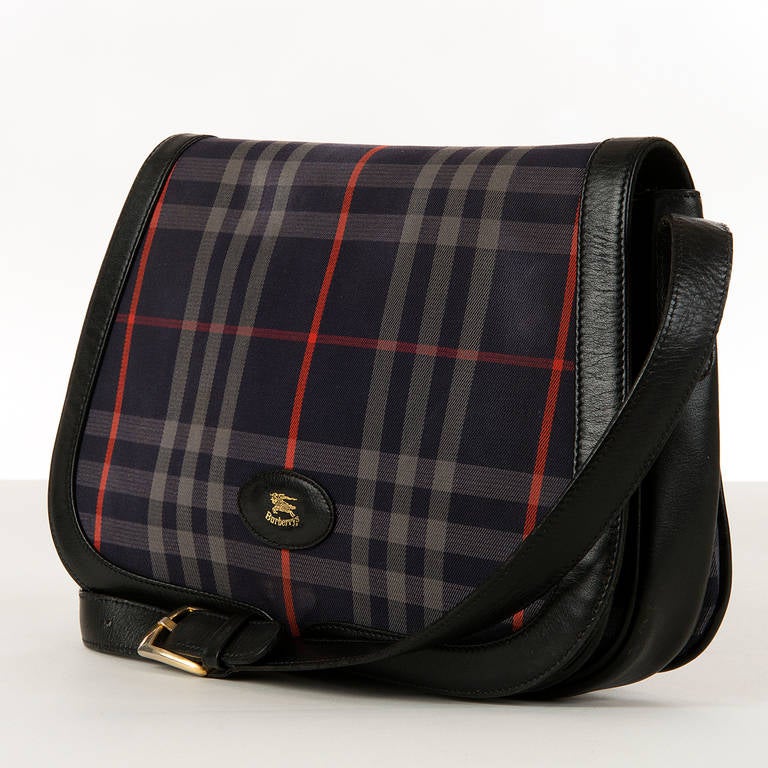 A classic, good quality Burberry 'Check', cross-body bag. The iconic Burberry look with their traditional high quality English manufacture.