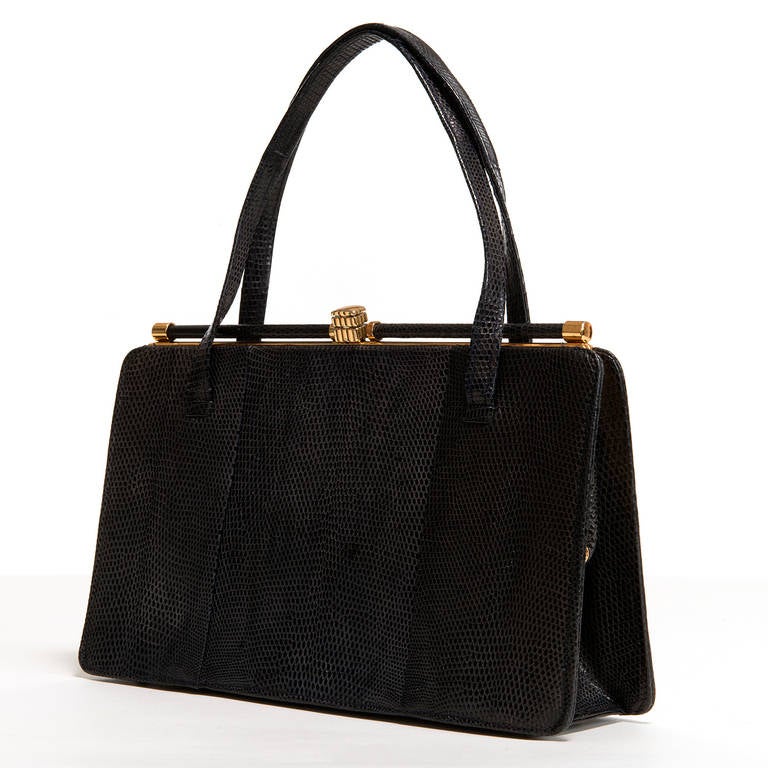 Riviera manufactured high quality Handbags, classic design, expensive materials, through out the 60's,70's and 80's. This is a fine example of their work, with great attention to detail. Inside there are three pockets, one zipped.