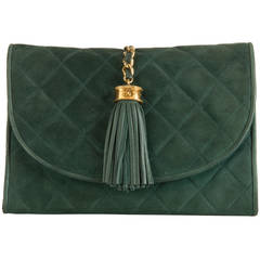An elegant Chanel Quilted Suede Clutch Bag in 'Forest Green'