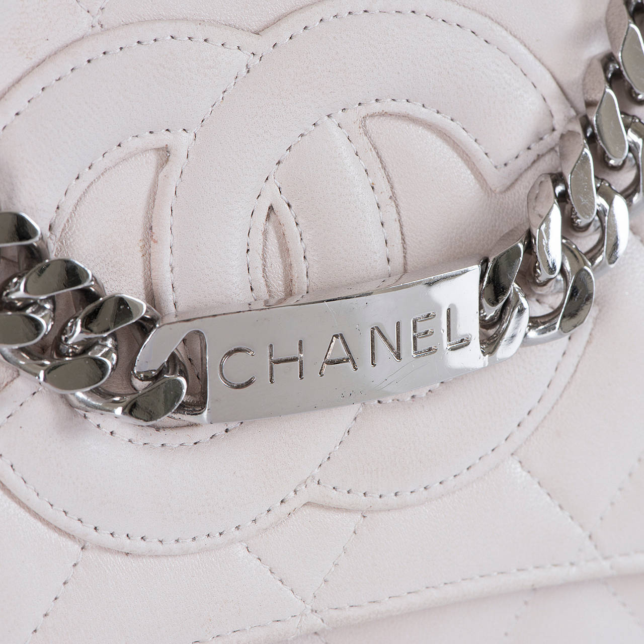 This very chic Chanel quilted 25cm bag, is in excellent condition and finished in  soft lamb-skin suede with a leather interior and the famous 'Double C' motif to the front flap. Retaining it's original dust sack and  Chanel Authenticity card, this