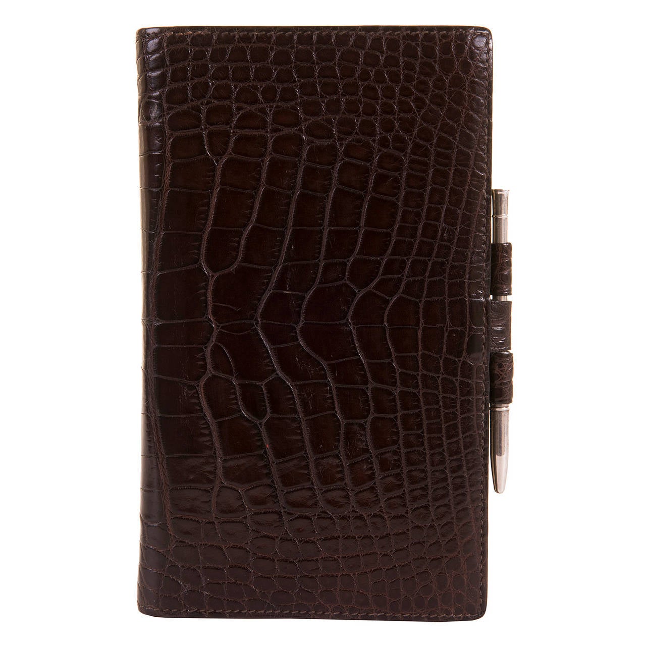 Just spoil yourself, or as a fantastic gift item, this Hermes Chocolate Brown crocodile, 'Notes & Agenda File', still retains it's original Hermes silver pencil (signed) together with it's unused lined paper files. The File appears unused and is in
