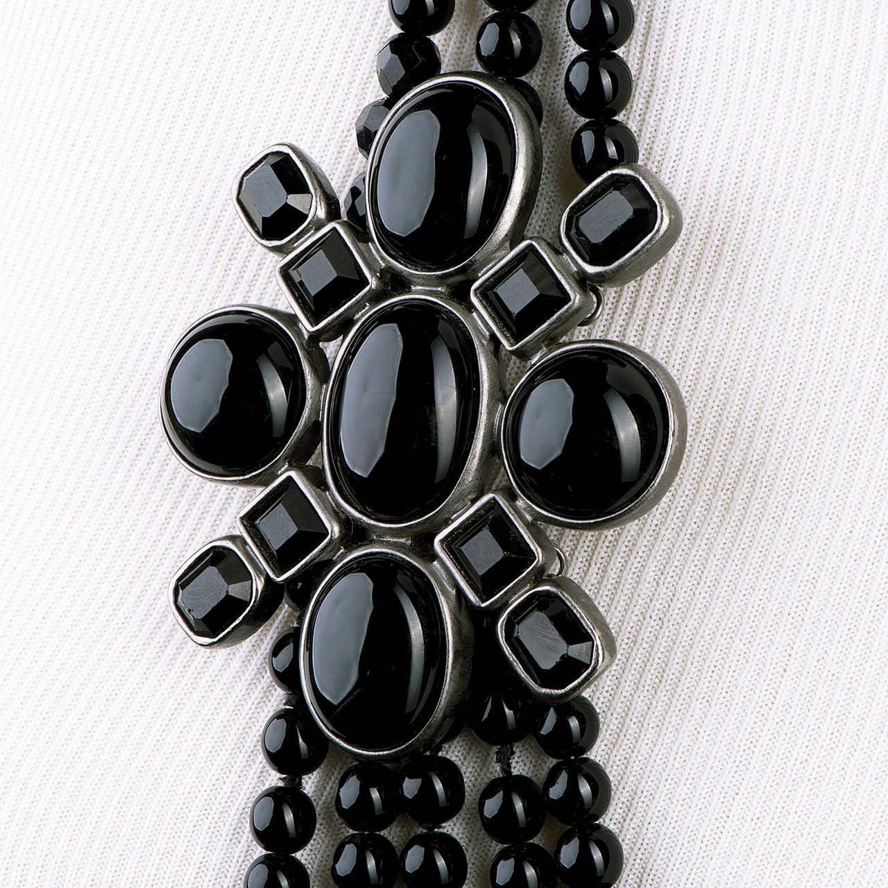 A Tres, Tres Chic Chanel Sautior, Necklace, made in circa 2005, consisting of five graduated rings of Black Glass Onyx Pearls, centred with a gorgeous silver pendant, inset with cabochons of 'Pate de Verre' Black Onyx. This stunning piece is Signed