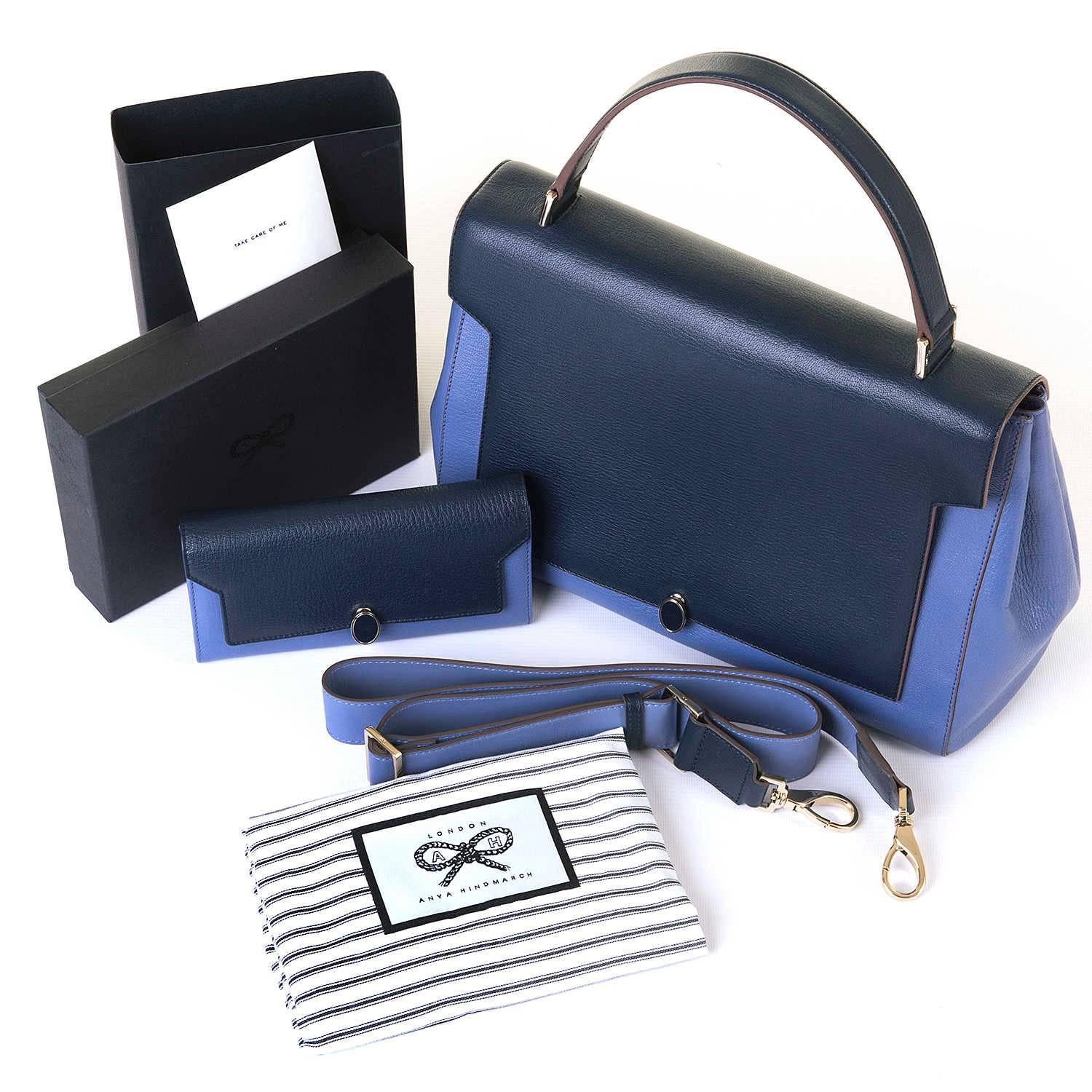 A fabulous, new & unused Anya Hindmarsh Bathurst GM Bag & matching Purse, in two-tone Navy & Lilac with silver palladium hardware. In store-fresh condition, the inside with all it's different labelled pockets and a full sized zipped pocket, is