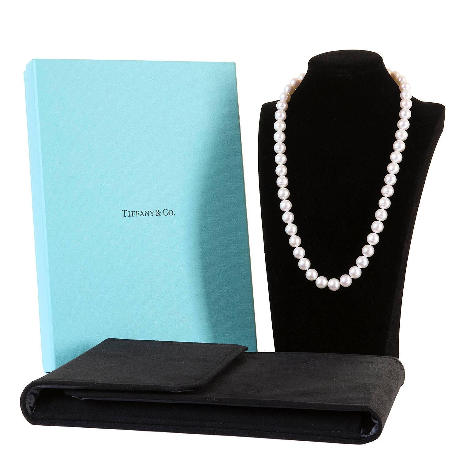 An Exquisite Cultured Pearl Necklace by Tiffany with a Tiffany '925' Solid Silver Clasp. The 6mm pearls are a beautiful iridescent white and are perfectly complemented by the Tiffany solid silver clasp. In pristine condition the pearl necklace comes