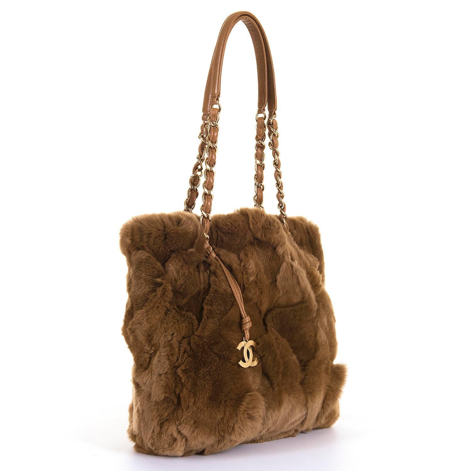 A rare and much sought-after Chanel Jumbo Fur Shoulder bag, finished in 'Chataigne' colour fur with camel leather trim and gold tone hardware. In pristine, store-fresh condition, the bag is decorated with a gold double 'C' fob, with double handles,