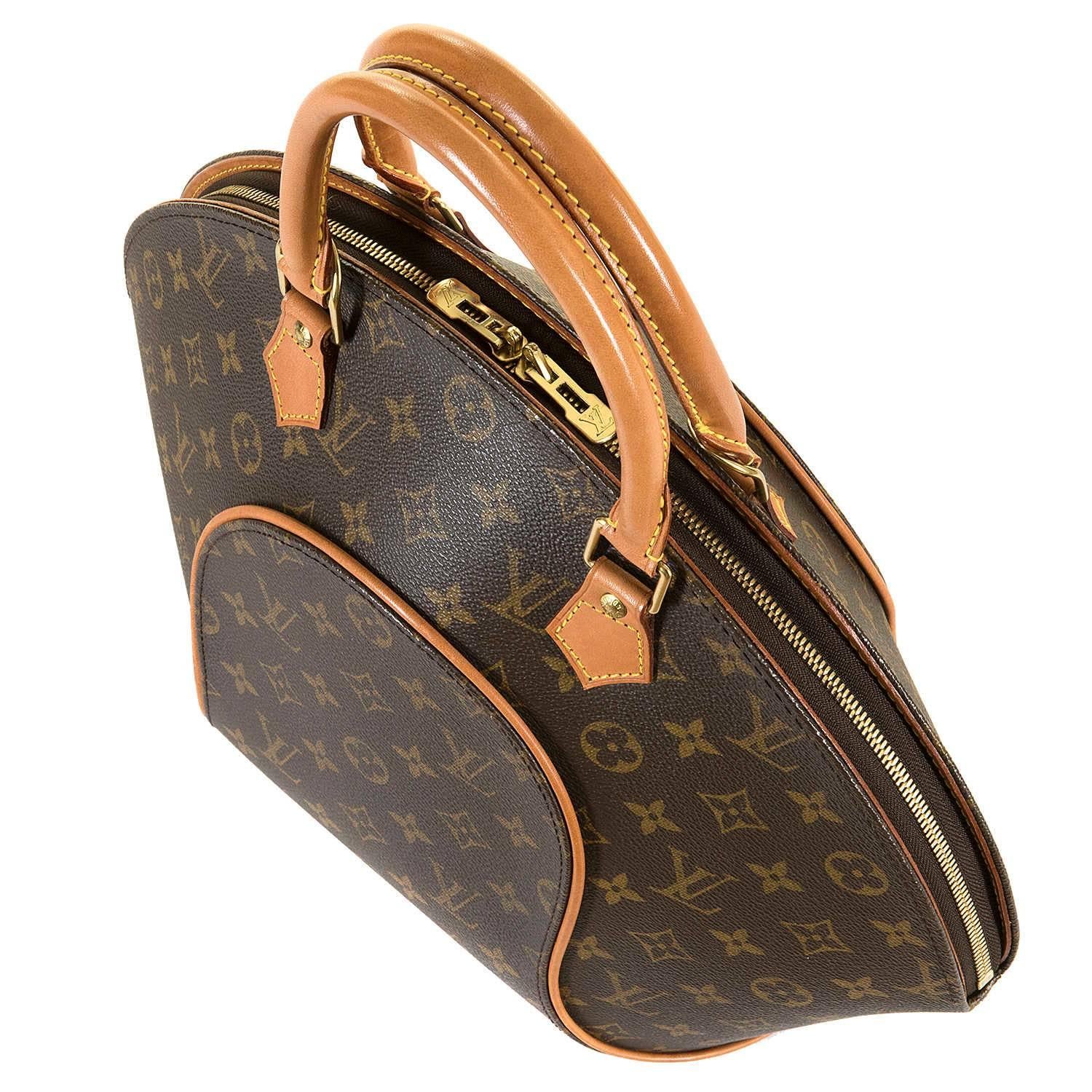 The Classic Louis Vuitton GM 'Sac Ellipse' in Monogrammed Toile with Natural Leather Trim. In excellent condition throughout, including the gold-tone hardware and importantly the natural leather trim, this iconic sculptured bag is fitted with two