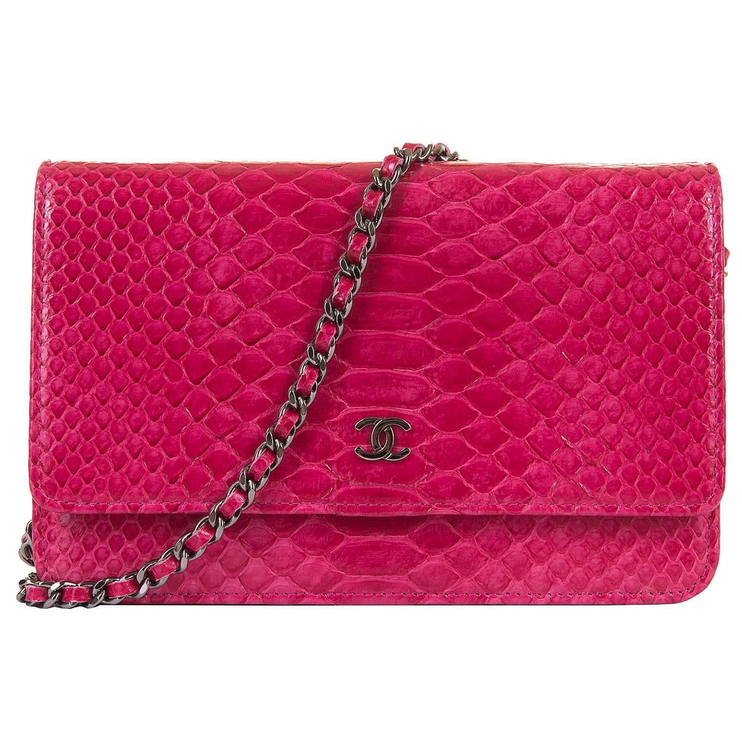 So, so Rare an absolutely stunning Chanel Fushia Pink Python skin Wallet on Chain/Bag with Silver Palladium Hardware. In pristine, store-fresh condition, throughout, the bag comes with it's original box, including packaging, ribbon etc. together