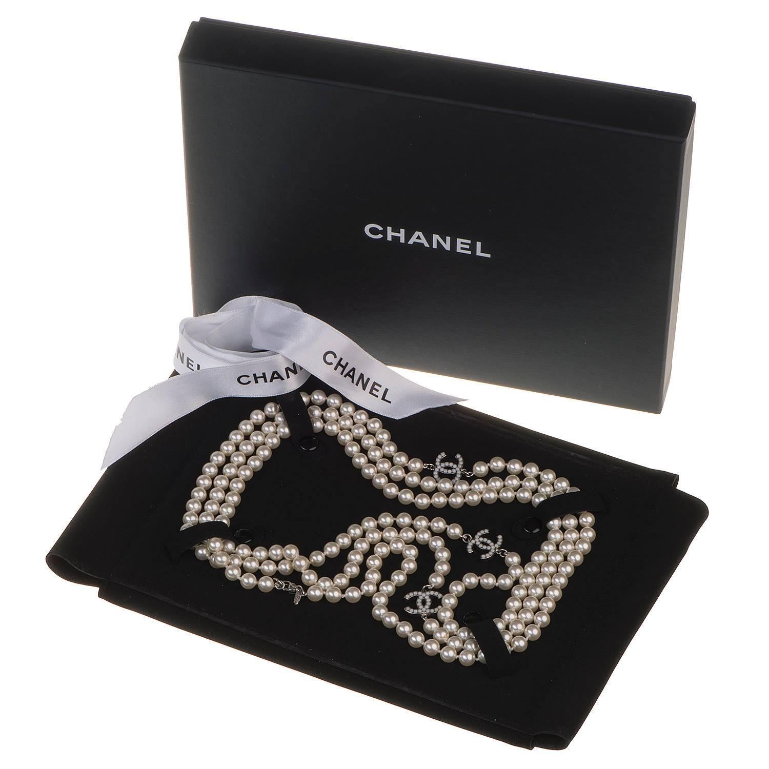 Pure Luxury !! This Chanel 3-String Sautior, decorated with three interlocking CC's, each inset with faux pearls in a white metal border. In absolutely pristine condition, this beautiful piece is 'Store-Fresh and comes with it's original gift box &