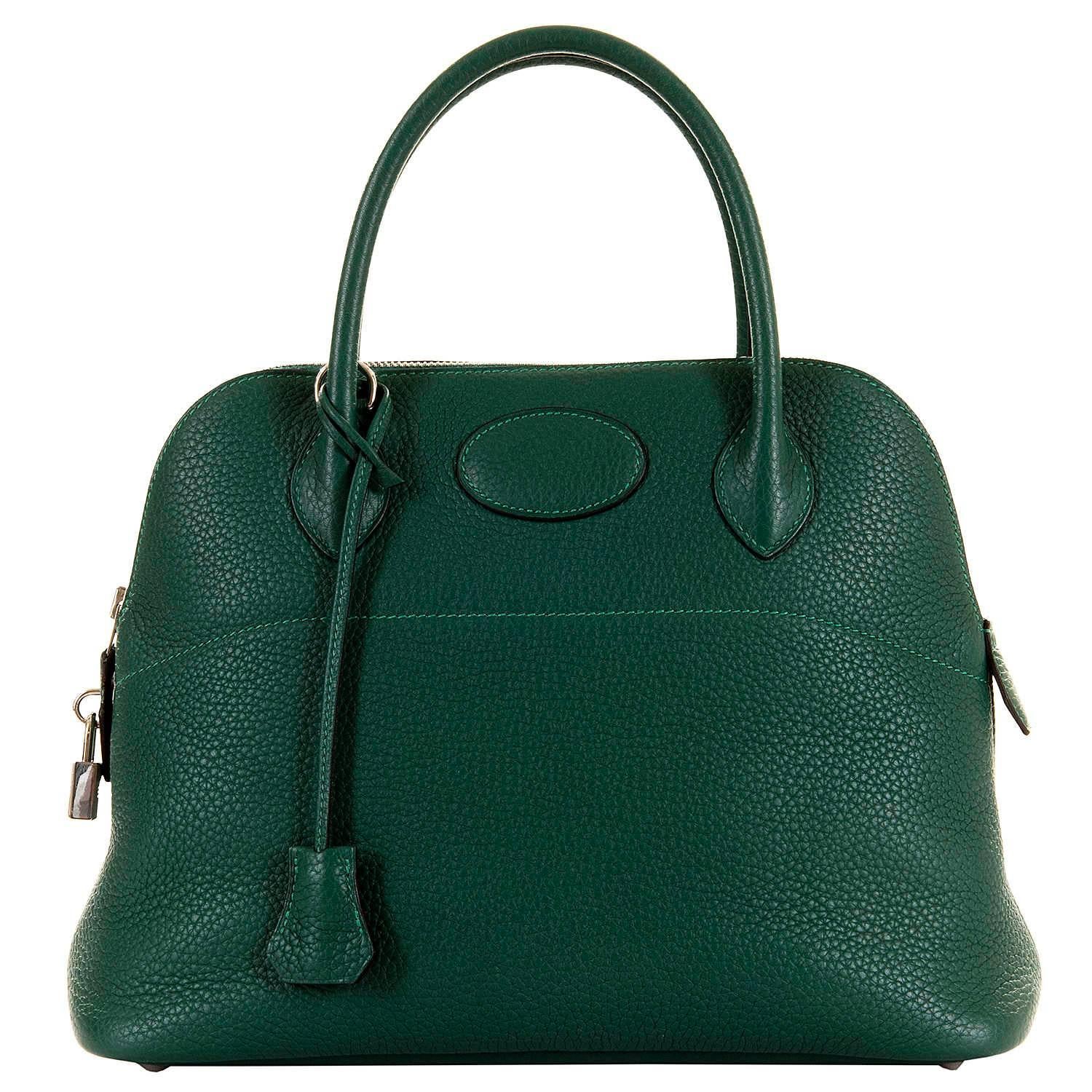 A simply stunning Hermes 31cm Bolide bag in rare Malachite Green. Finished in scratch resistant Togo leather, with silver Palladium hardware. Bearing the Hermes date Stamp 'O' in a square, for 2011, the bag is in absolutely pristine, 'New &