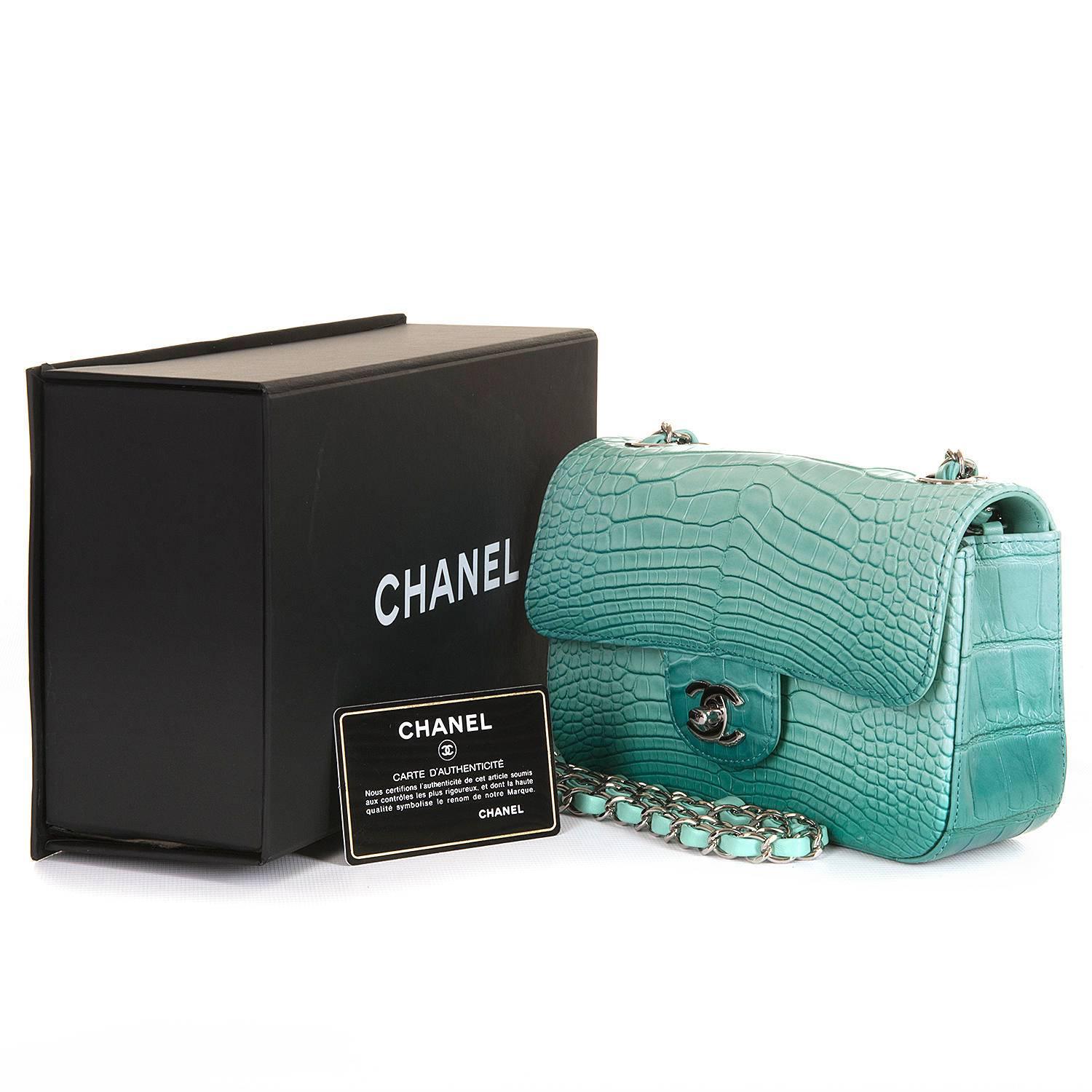 An absolutely Sensational Chanel New Mini Sac Timeless finished in Iced-Turquoise Alligator with Silver Palladium Hardware.This top of the range Chanel bag has never been worn and still retains the plastics on some of it's hardware. Complete with