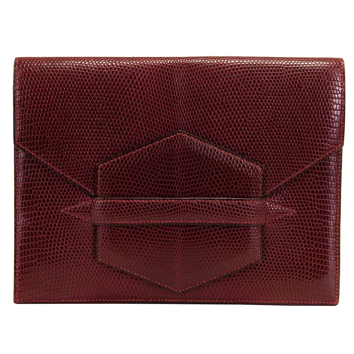 A Very Elegant Rare Vintage Hermes 'Faco' Clutch bag. Finished in Burgundy Lizard, this special order bag is in absolutely pristine condition throughout, with the interior in a matching lambskin and fitted with three individual pockets and a