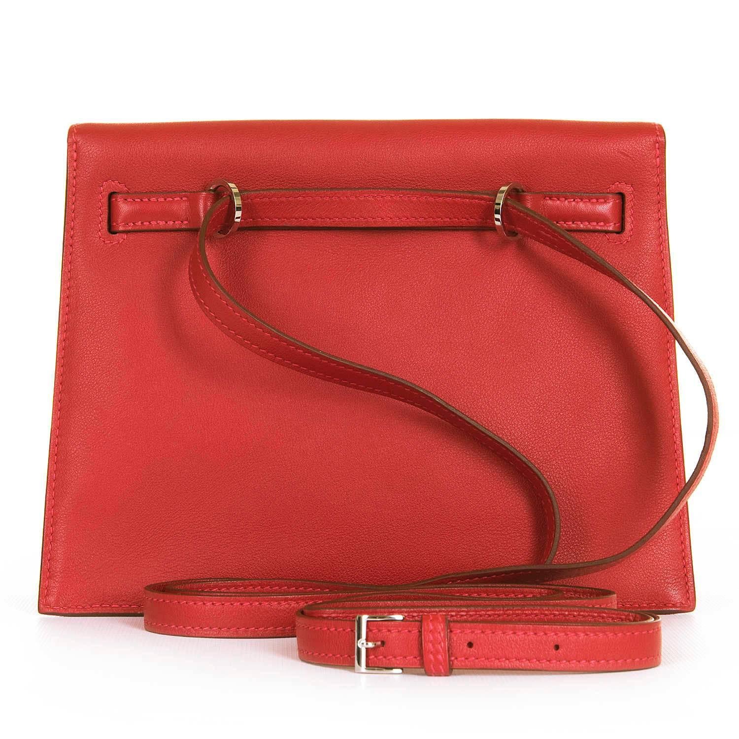 A Fabulous Hermes Kelly 'Danse' in Stunning Imperial Red Swift Leather with Silver Palladium Hardware. This Very special Kelly Bag is no Longer available at Hermes. In pristine condition, still with the plastics on the clasp, the bag can be worn as