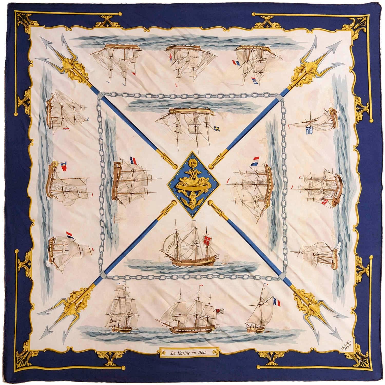 A very rare vintage Hermes silk Scarf, 'Le Marine en Bois' by Hugo Grygkar, designed in 1957. Sixty years old, this Hermes heritage piece, with it's nautical theme is in a great colours - Blue border with cream & gold ground, and will compliment