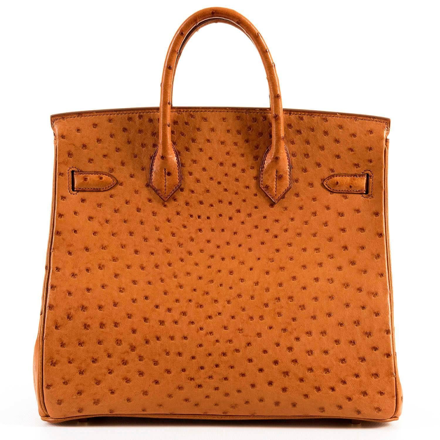 Ultimate Rare Luxury - A Hermes HAC Birkin Bag in Saffron colour Ostrich skin, beautifully accented with gold hardware. This Haut a Courroies - HAC Birkin has the Hermes blind stamp 'F' in a square, for 2002, and is in absolutely pristine condition