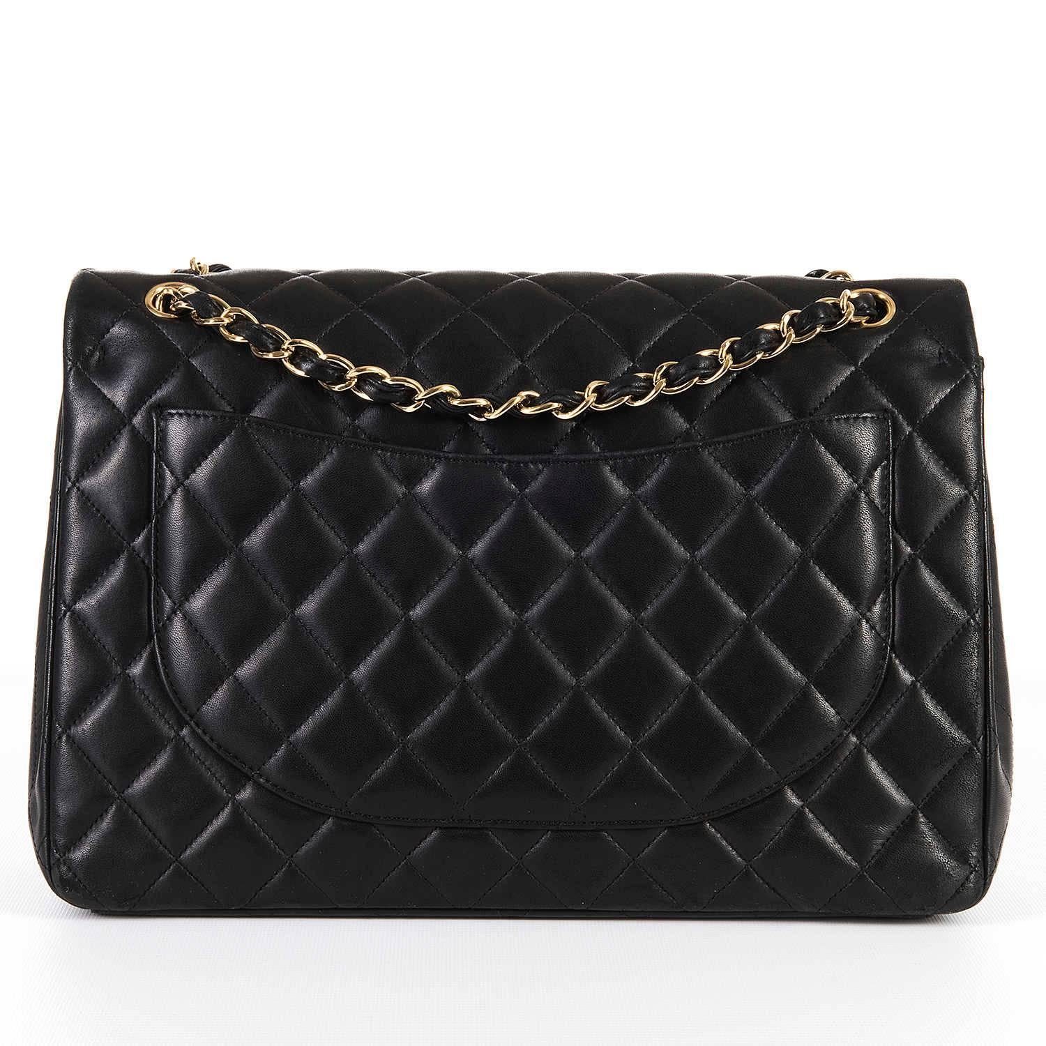 The Classic Chanel Black 'Maxi' Quilted, Double-Flap 'Sac Timeless' with Gold Hardware. In excellent condition, the bag comes with it's Chanel authenticity card and dust sack. Circa 2012, the bag's serial number is 16288391.
