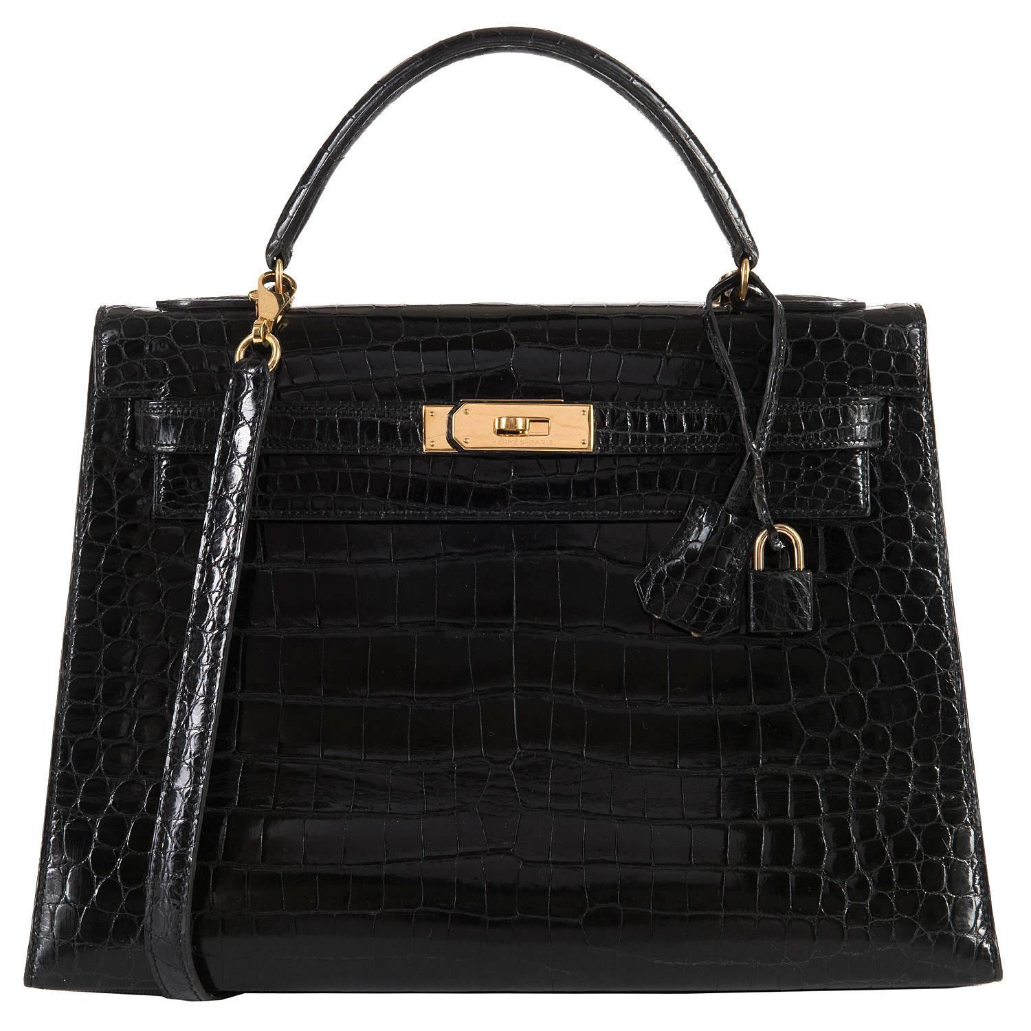 This Rare Hermes Black Crocodile Kelly Bag is in pristine condition throughout.The interior is finish in Black Chèvre leather and has a full length zipped pocket, with an open pocket to the other side. Fitted with a detachable shoulder strap, the