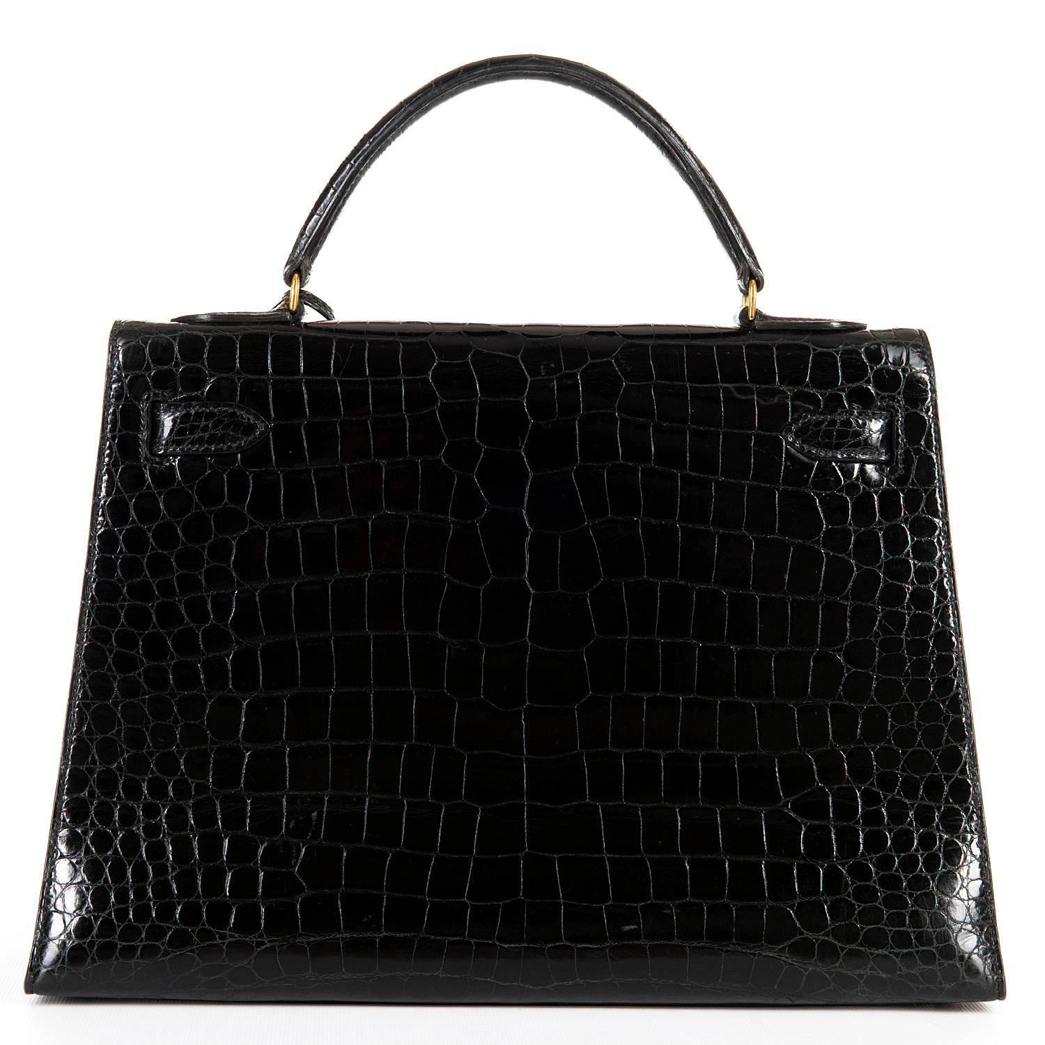 Pristine Hermes 32cm Shiny Black Crocodile Kelly Bag with Shoulder Strap and GHW In Excellent Condition In By Appointment Only, GB