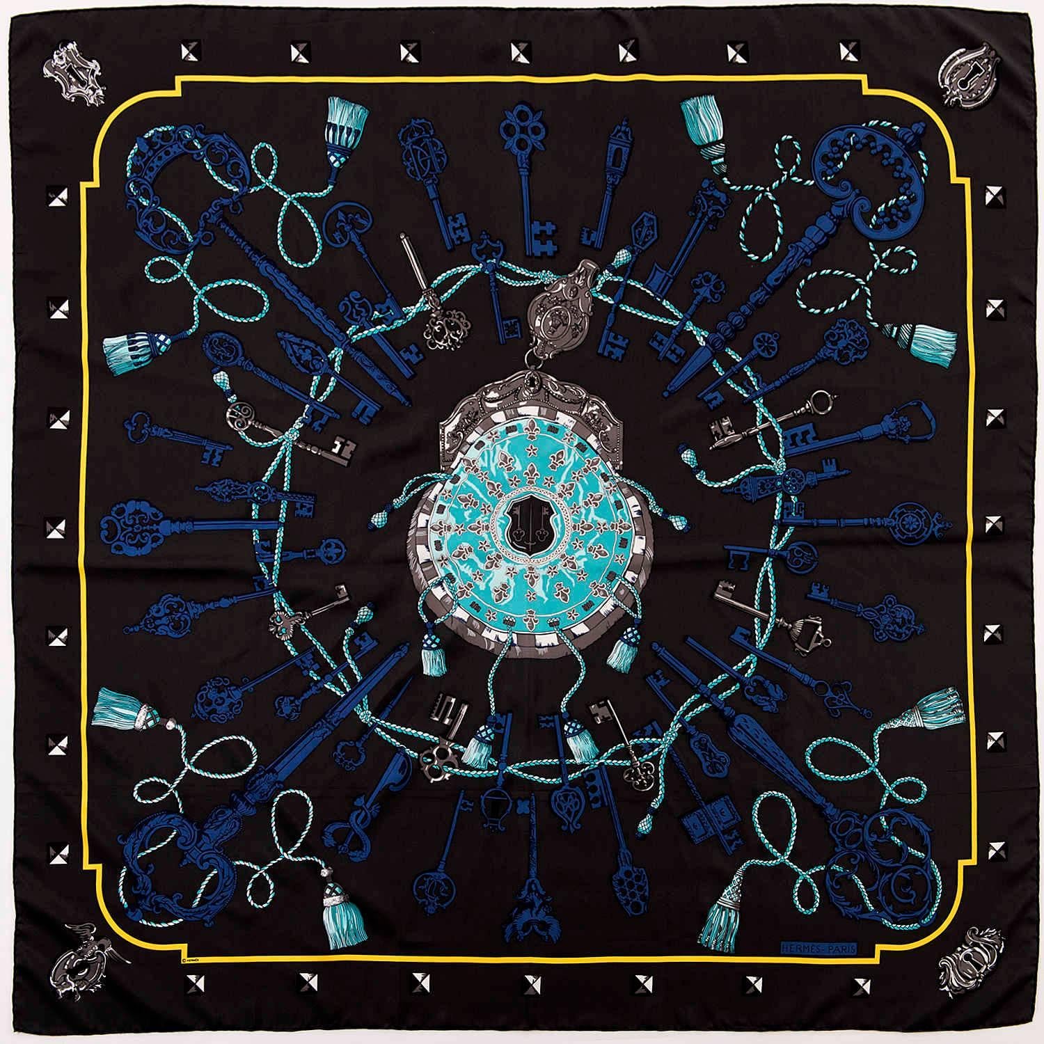 'Les Clefs' is a truly beautiful Hermes silk shawl, designed by the famous Hermes Designer Caty Latham in 1965.  In pristine 'store-fresh' condition, this design is now unavailable to buy in Hermes stores. On a grey/black ground, overlaid with a