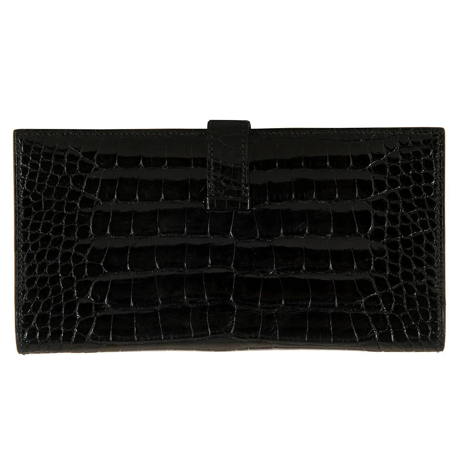 This Fabulous Hermes Shiny Black Crocodile Alligator 'H' Bearn Wallet is a very rare piece indeed. In absolutely pristine condition throughout, the Wallet comes with it's original Hermes box and dust sack. The ultimate luxury accessory, the wallet