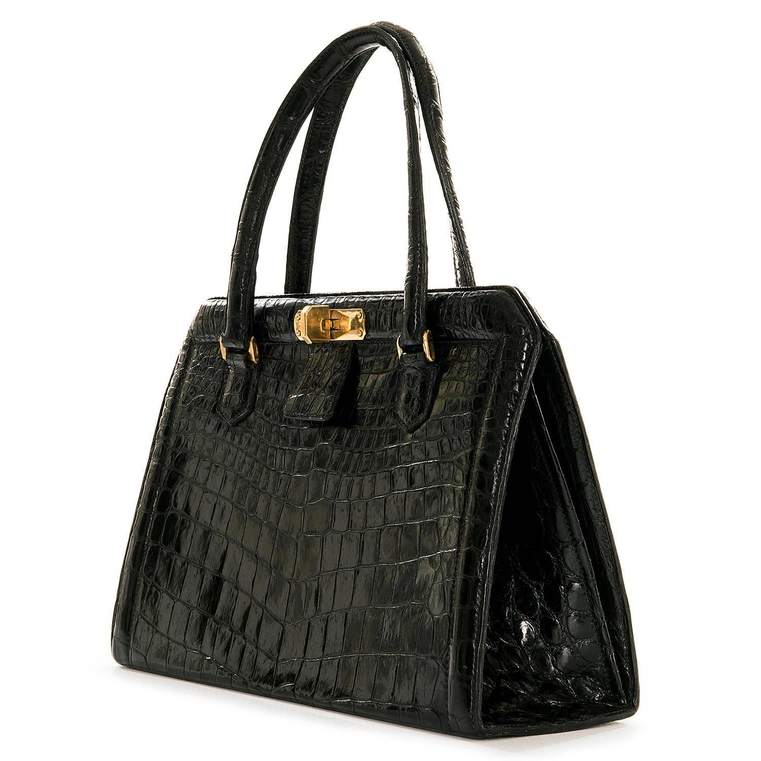 A very rare vintage Hermes Shiny Black Crocodile 'Sac Metro'. In superb condition, the bag is finished with gold metal hardware, with matching chèvre leather to the interior, the interior having one zipped compartment, one buttoned flap compartment