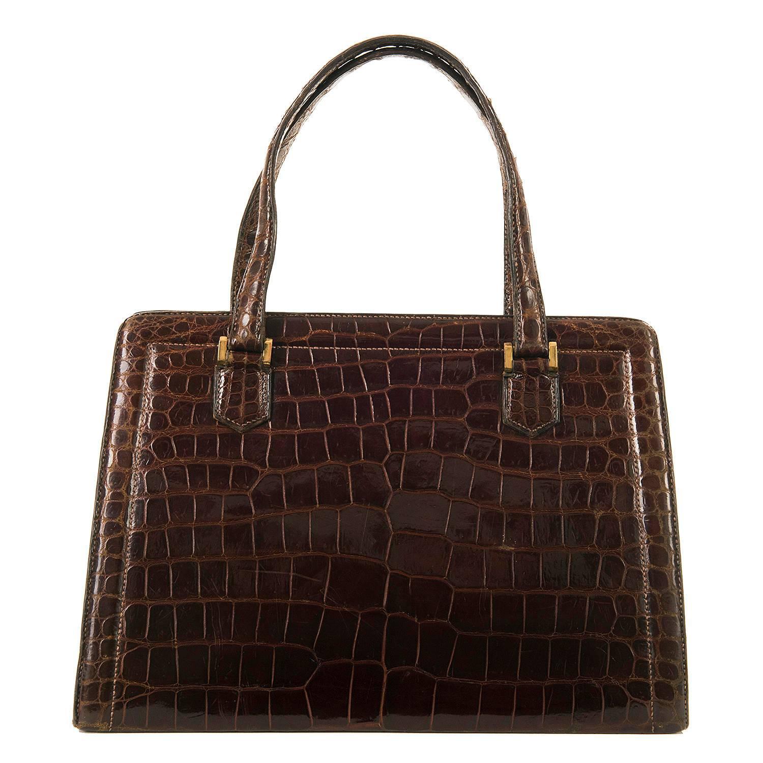 The very, very rare, much loved and much sought after Hermes 30cm Cognac Shiny Crocodile 'Sac Pullman'. The fore-runner to the famous Hermes Kelly bag, this bag bears the Hermes gilt stamp for HERMES PARIS 24 FBG ST HONORE, Hermes original Atelier