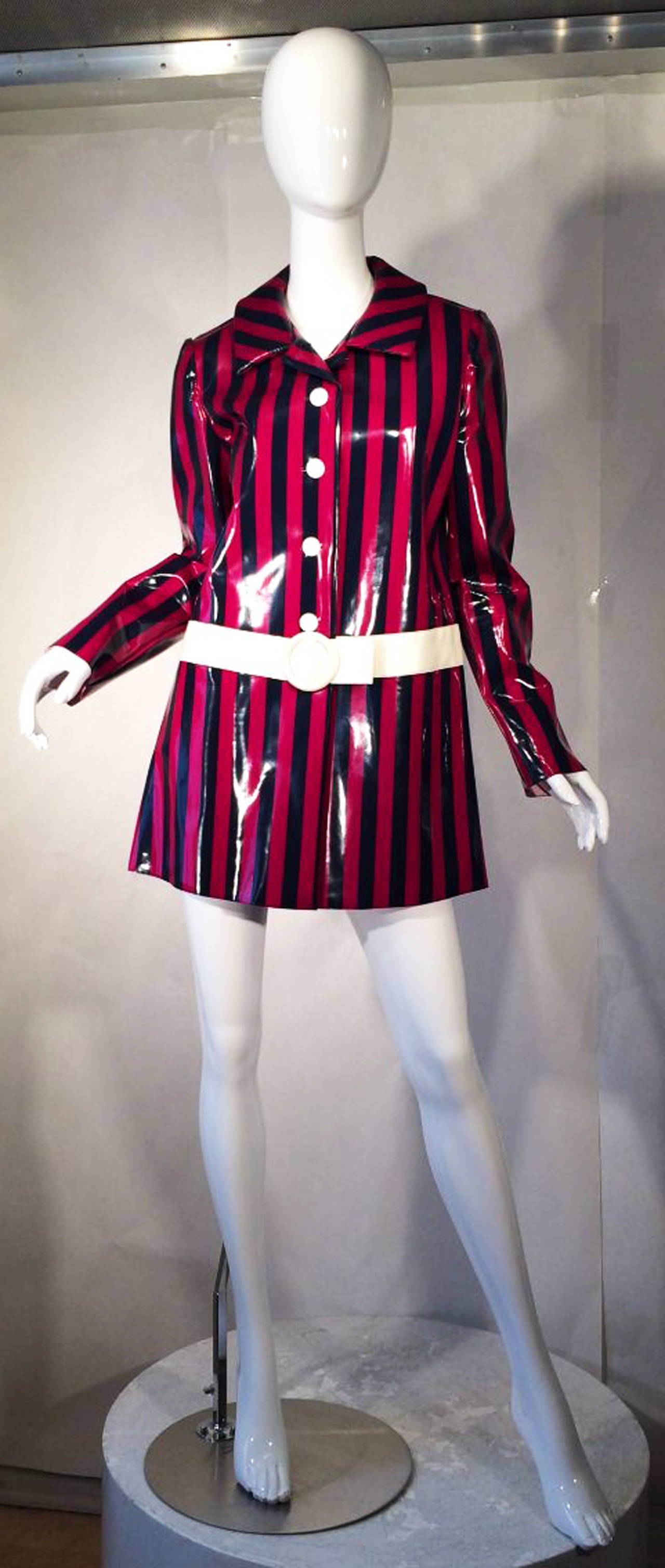 A fine vintage Mary Quant vinyl slicker rain jacket. Mod vinyl coated awning stripe item features a built in white vinyl belt and buttons. Item worn by Joan Collins for the film, These Old Broads co-starring Debbie Reynolds, Shirley Maclaine and